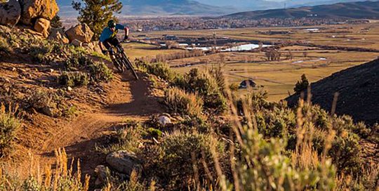 A mountain biker as sun goes down at Hartman Rocks Recreation Area