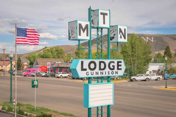 MTN Lodge Gunnison Sign with flag